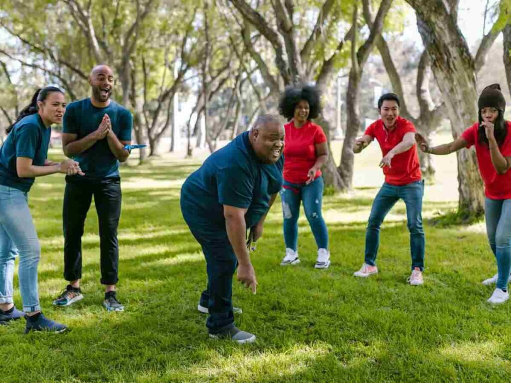 group pf people exercising in park