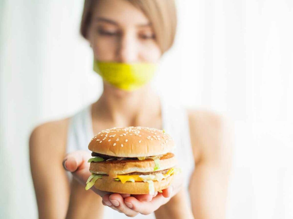 lady ignoring junk food to eat