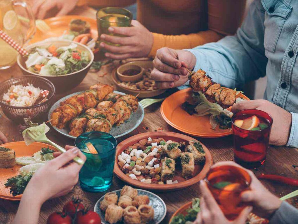 group of friends taking heavy meal in dinner at a restaurant