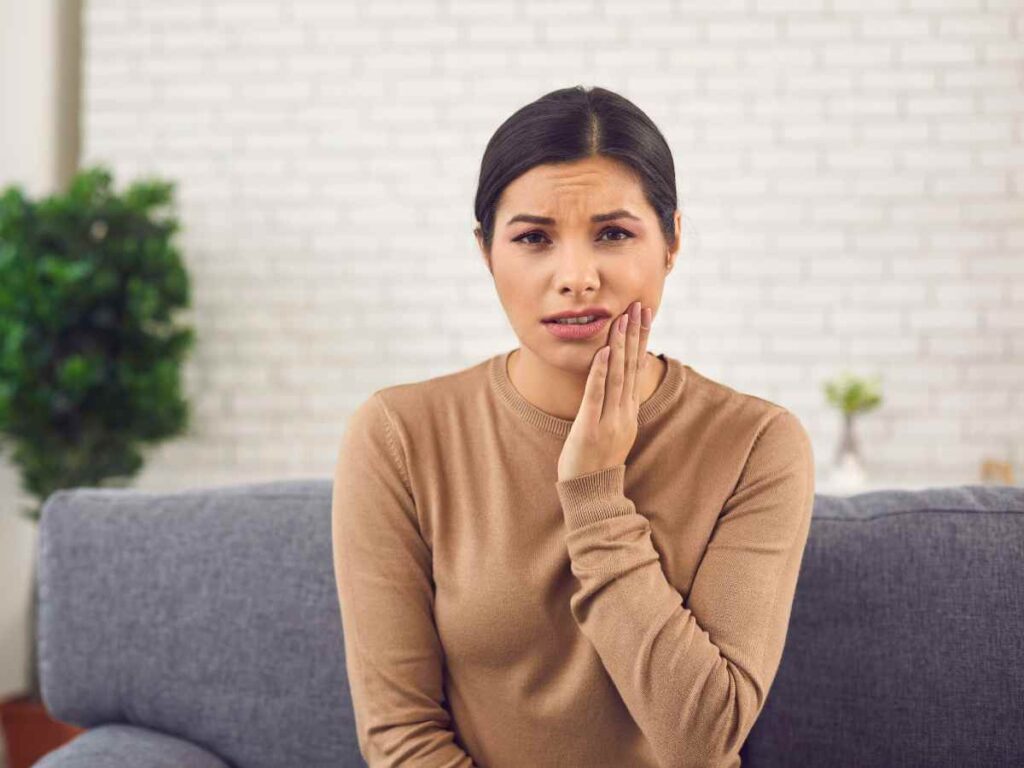 lady suffering from gum disease because of poor oral health