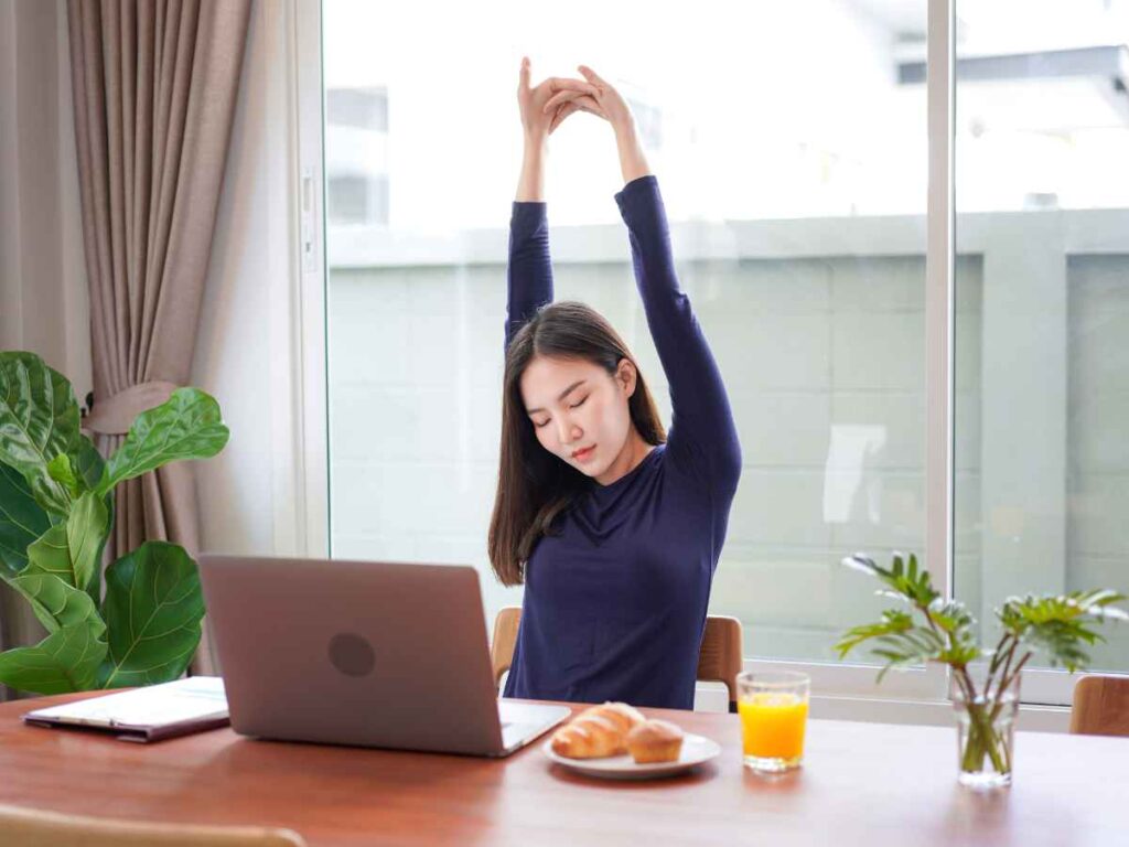 taking break during work to stretch the whole body