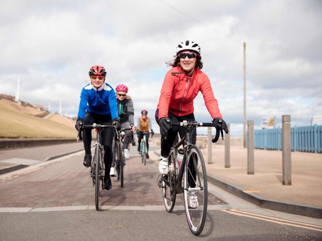 friends cycling on the road