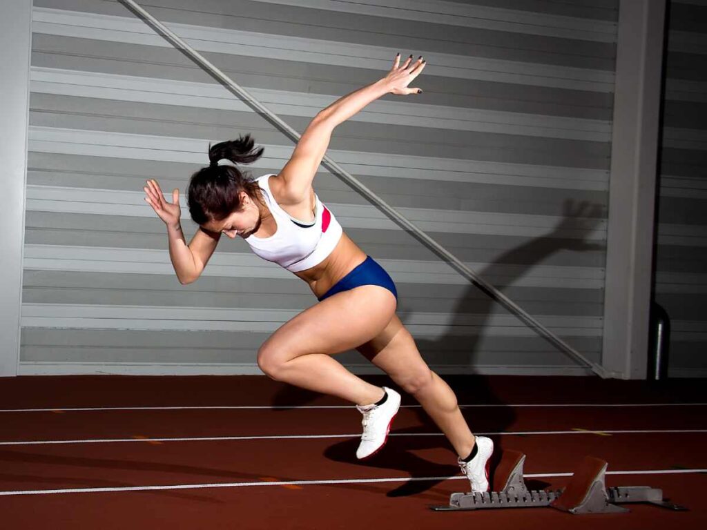 woman sprinting in a gym