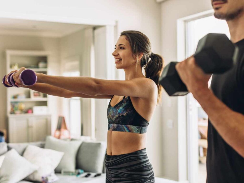 couple doing weight lifting at home