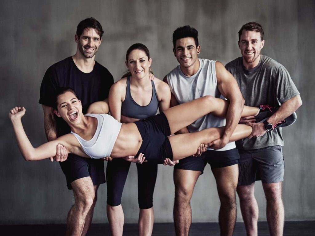 group of friends feeling happy at the gym